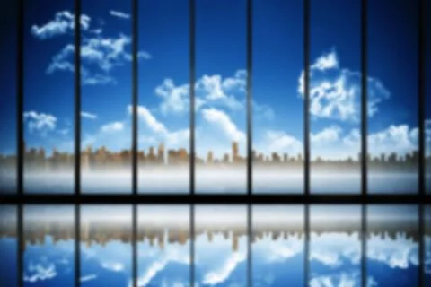 Digital composite image of city against blue sky Ilustración de archivo