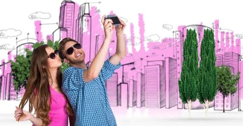 Digital composite image of couple taking selfie with buildings and trees in Fotos de archivo