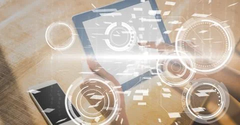 Digital composite image of hands using digital tablet 写真素材