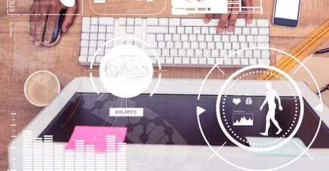 Digital composite image of hands using computer on table Stock Photos