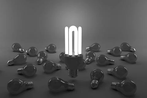 Digital composite image of illuminated energy efficient lightbulb over bulbs Illustrazione stock