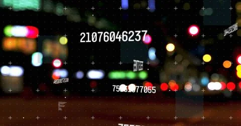 Digital composite image of multiple changing numbers against night city traffic Foto stock