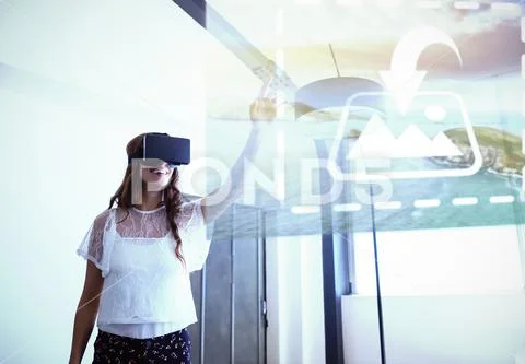 Digital composite image of smiling businesswoman using virtual reality headset PSD Template