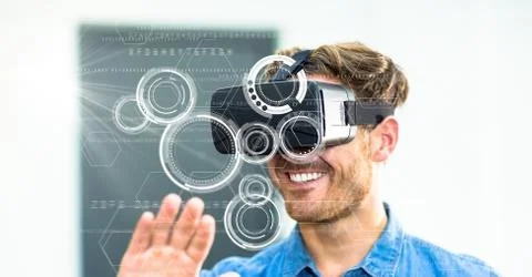 Digital composite image of smiling man using VR glasses Stock Photos