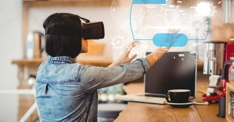 Digital composite image of woman using VR glasses 스톡 사진