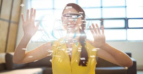 Digital composite image of woman using VR glasses 스톡 사진