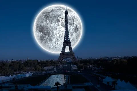 Digital composite of Large moon over paris Stock Photos