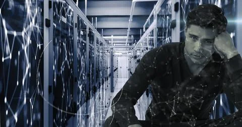 Digital composite of man with math and molecules in server room symbolizes 写真素材