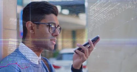 Digital composite of man on phone with data and graphs overlay signifies global Foto stock