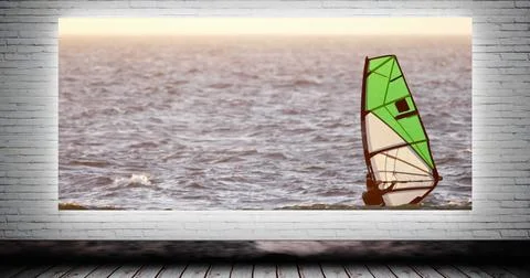 Digital composite of man wind surfing canvas mock up against animated grey brick Stock Photos