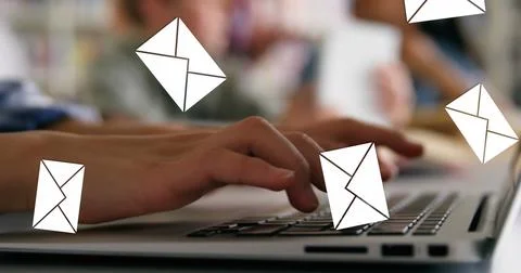 Digital composite of a pair of hands typing on a laptop with message icons Stock Photos