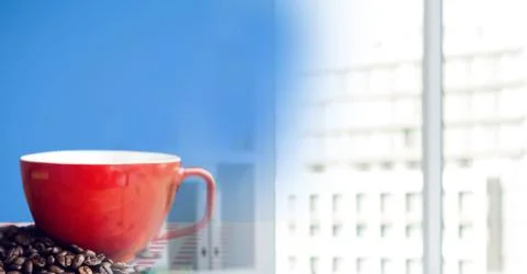 Digital composite of Red coffee cup on red and white table cloth with beans a Stock Photos