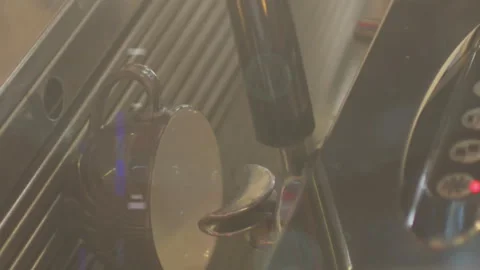 Digital composite video of spots of light against mid section of barista Stock Footage 315156176