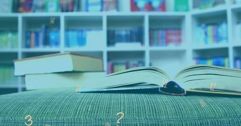 Digital composition of multiple numbers and symbols floating against stack of 写真素材