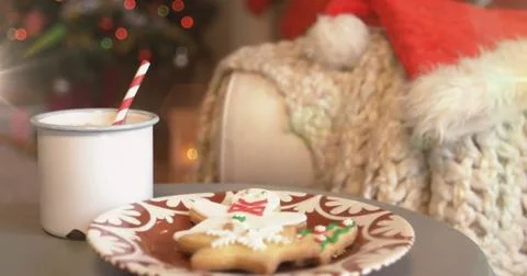 Digital composition of spots of light against cup of hot chocolate and 스톡 일러스트