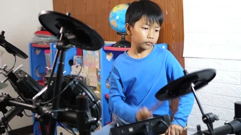 Digital content creator, asian child boy play electronic drum with fun face. Video stock 281129718