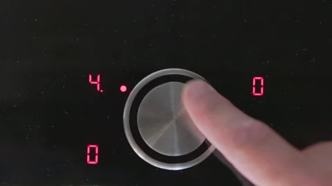 Digital controls illuminate in vibrant red as the cooking timer awaits setting i Stock Footage 281598944