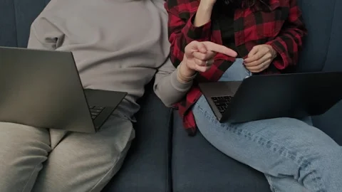 Digital couple works or studies on laptops in cozy home setting. Trendy concept Stock-Footage 283852984