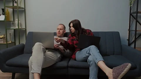 Digital couple works or studies on laptops in cozy home setting. Trendy concept Vídeo Stock 283853227