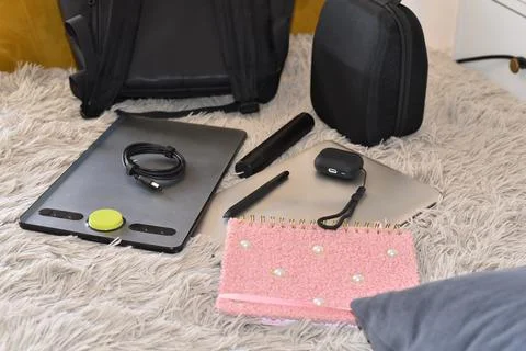 Digital creative tools personal electronics spread on rug overhead view Foto stock