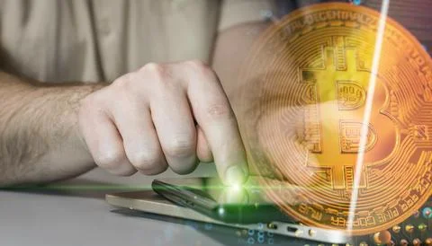 Digital cryptocurrency: tapping a smartphone with a bitcoin icon and a bloc.. Stock Photos