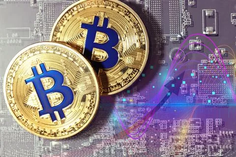 Digital currency security. Bitcoins on computer circuit board, top view. Grap Stock Photos