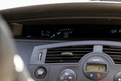 A digital dashboard display inside a modern vehicle shows speed and engine .. Stock Photos