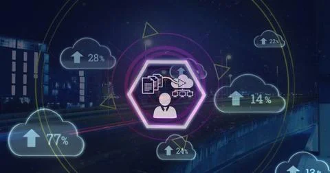 Digital data icons floating over cityscape at night, illustrating cloud Stock Photos