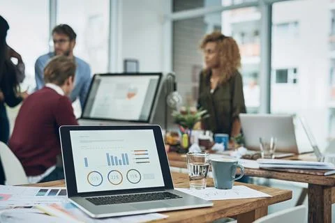 Digital data, office and laptop with graphs for business, trading and financial Stock Photos