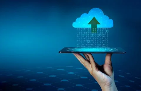 Digital data set of binary numbers being sent to the clouds on a blue backgro Stock Photos