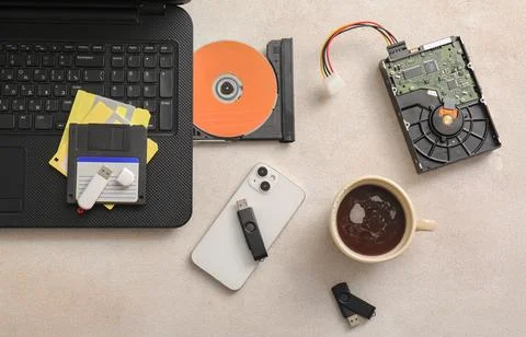 Digital data storage evolution with floppy disks, CD-ROM, hard drive, USB dri Stock Photos