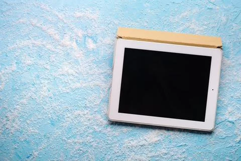 Digital Detox concept.  switch off tablet  around salt at blue background Stock Photos