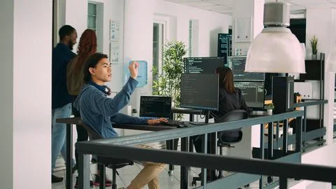 Digital developer analyzing ar hologram to work on html script Stock Photos