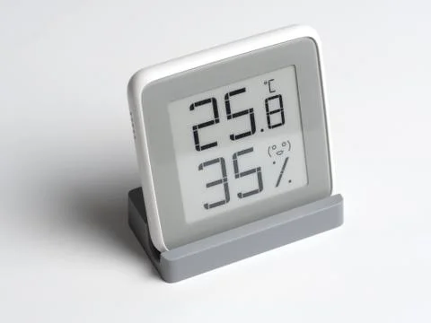 Digital device for determining the humidity and temperature in the room. Stock Photos