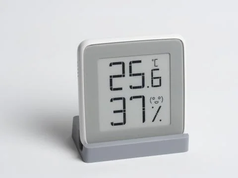 Digital device for determining the humidity and temperature in the room. Stock Photos