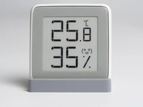 Digital device for determining the humidity and temperature in the room. Stock Photos