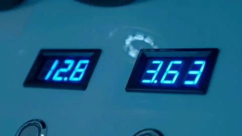 Digital display with changing digits on a blue panel with round buttons Stock Footage 188070520