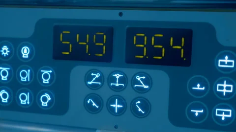 Digital display with changing digits on panel with icons of industrial equipment Stock Footage 188068823