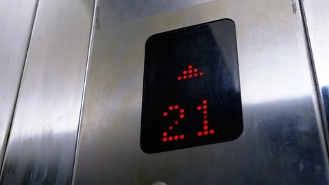 Digital Display in the Elevator with Arrow Up Shows Floors from 21st to 24th Stock Footage 120540177