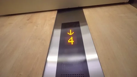The digital display in the elevator with a down arrow Shows the floors . Stock Footage 171668792