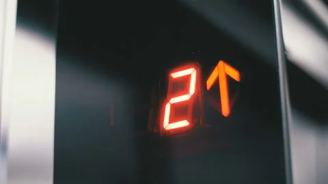 Digital display in the elevator which rises up on floor with an arrow up Stock Footage 98135999