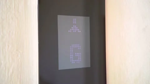 Digital display in the elevator which rises up on floor with an arrow up Stock Footage 155479755