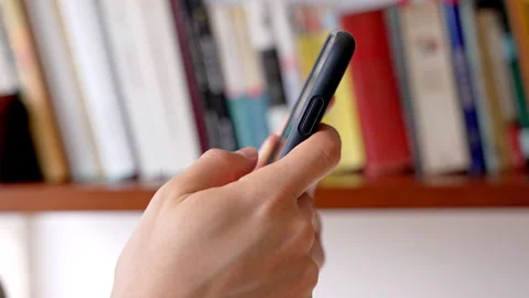 Digital Distraction: Scrolling vs. Reading Stock Footage 282675545