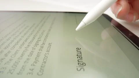 Digital Document Signing Process with Electronic Signature on Tablet Stock Photos