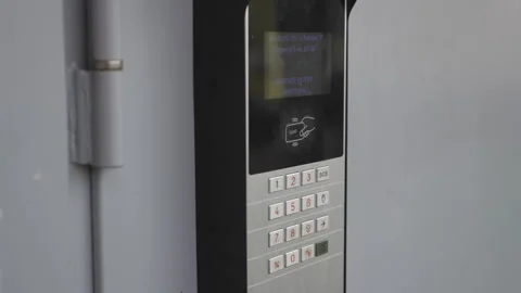 Digital door entry panel mounted beside entrance closeup Video stock 306460957