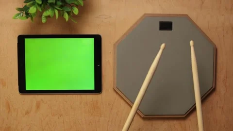 Digital drumming practice setup with green screen tablet and drumsticks Vidéo 341737734