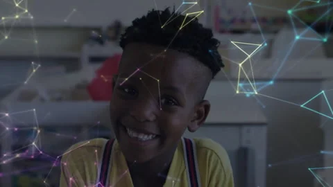 Digital education network pulsing around face sparking boy smiling at camera in Stock Footage 313148176