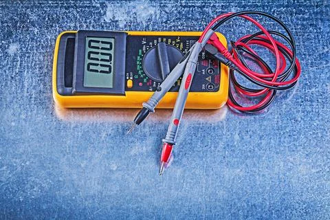 Digital electrical tester Test leads on metallic background Stock Photos