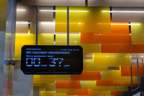 Digital electronic display board showing train arrival time in modern subway Stock Photos