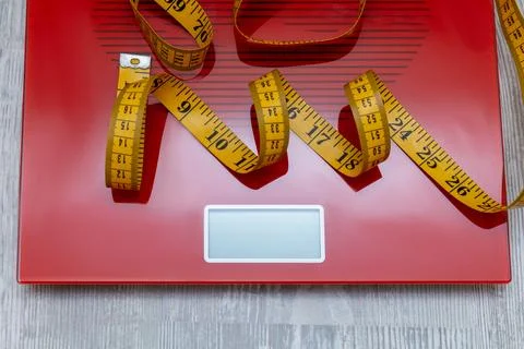 Digital electronic scale with measuring tape. diet, slimming concept. Stock Photos